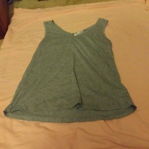 A gray v-neck tank top